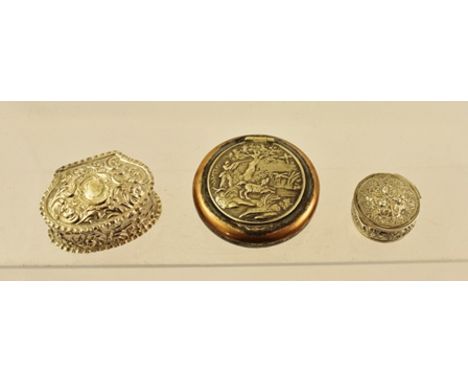 TWO VICTORIAN DESIGN SILVER PILL BOXES having floral repousse decoration, largest 5.5cm wide, combined weight 40g together wi