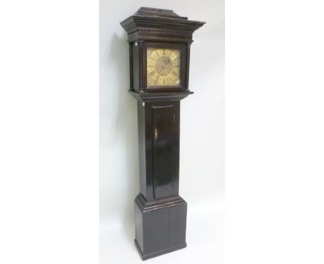 A GEORGE III 30 HOUR LONGCASE CLOCK, the ebonised case with flat top (later caddy extension), having dentil cornice and colum