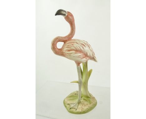 A GOEBEL 1979 PORCELAIN MODEL OF A FLAMINGO standing in reeds, decorated in matt polychrome, 20cm high 