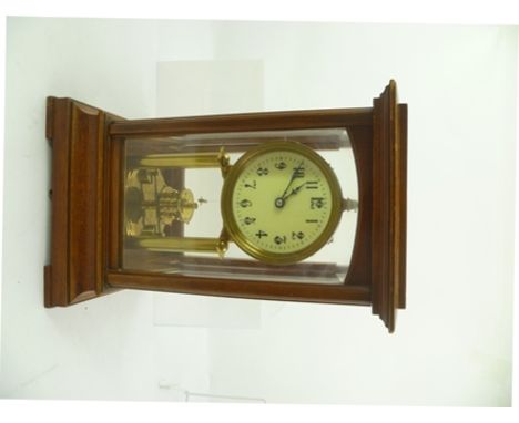 A GUSTAV BECKER BRASS PILLAR TIMEPIECE having circular enamel dial with Arabic numerals in a glazed mahogany outer case, 30.5