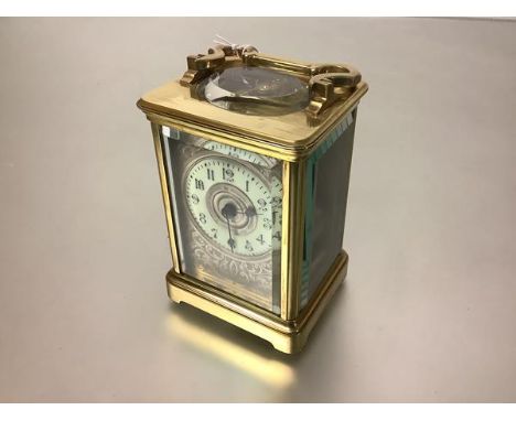 A handsome French 19th century brass-cased carriage clock, the eight day movement striking the hour and half hour on a gong, 