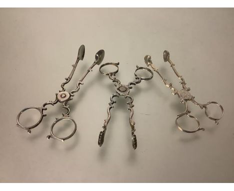 A group of three 19th century silver scissor-action sugar nips, one marked for Yapp &amp; Woodward, Birmingham 1849, the othe