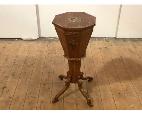 A late 19th century painted satinwood work table, the octagonal top with painted portrait roundel, within a border of rose bo