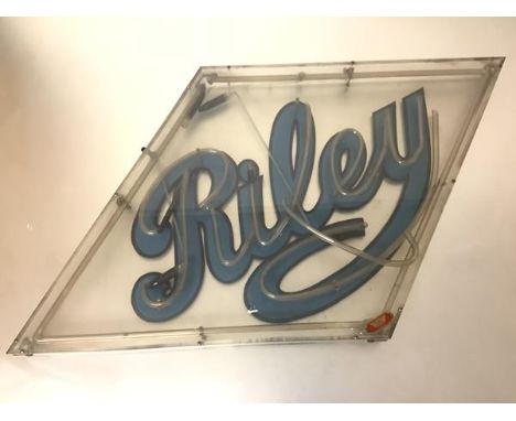 A vintage large neon advertising sign for Riley Cars, in a lozenge-shaped frame (a/f). 59cm by 102cm