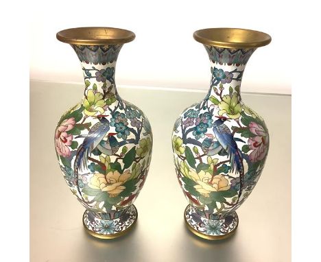 A pair of striking Japanese cloisonne enamel vases, of baluster form, each polychrome decorated with pheasants perched amidst