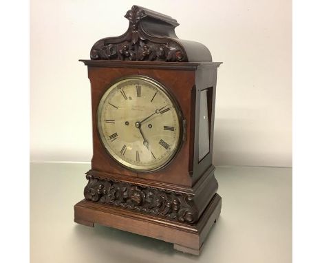 A late 19th century carved oak cased bracket clock, the silvered 7 1/2" dial signed "Hugh Connell, Oxford Corner, Glasgow", w