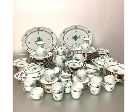 An extensive Herend porcelain dinner service for twelve with a partial tea and coffee service, all in the green Chinese Bouqu