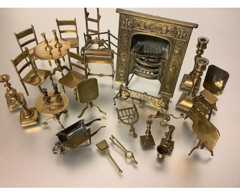 A collection of miniature brass furniture, including a fireplace, fender and tools, set of four ladderback chairs, five tilt-