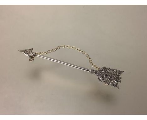 A diamond-set jabot pin, early 20th century, modelled as an arrow, set with thirteen old brilliant-cut stones on a 15ct gold 