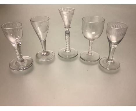 A group of five late 18th and early 19th century drinking glasses including: a cordial glass with diamond-cut waisted stem; a