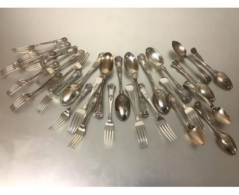 A 19th/20th  century composed King's and Queen's pattern silver partial flatware service comprising: six table spoons, Ackroy