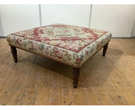 A modern centre stool, the padded rectangular seat covered in a tapestry wool fabric of Aubusson design, raised on turned leg