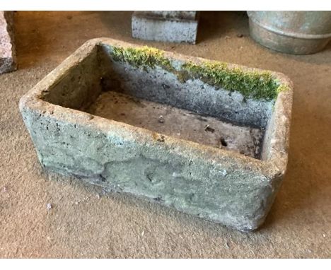 A weathered sandstone garden trough, of rectangular form. 22cm by 36cm by 58cm