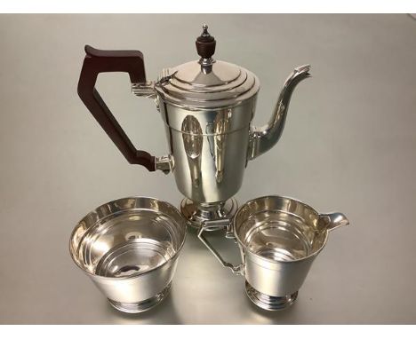 A George V silver three piece bachelor's coffee service, Fenton Russell &amp; Co. Ltd, Birmingham 1930 and 1931, in the Art D