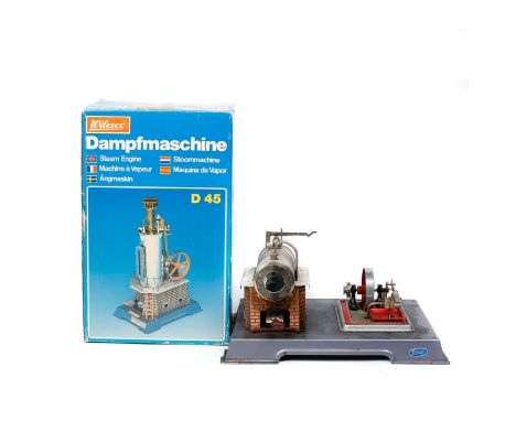2 spirit fired Stationary Engines by Wilesco. A vertical boiler single cylinder engine (D45) with whistle and water sight gla