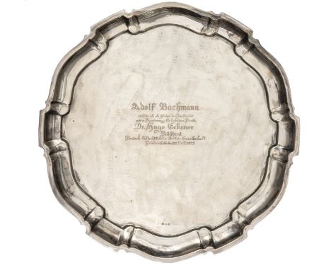 A presentation silver tray, with gadrooned border and 835 purity mark. Engraved “Adolf Bachmann verliehe ich als Zereichen de