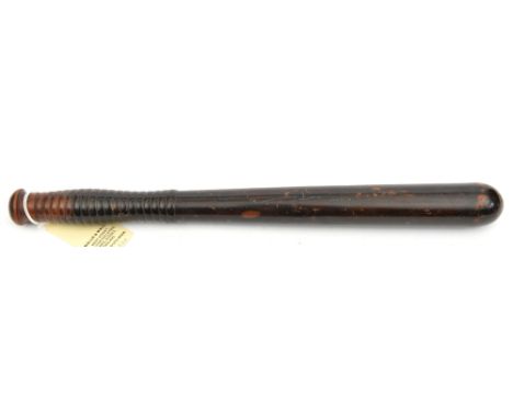 A Vic darkened hardwood truncheon, the ribbed grip with maker’s name on the pommel “Field, 22 Tavistock St, WC”, the body sta