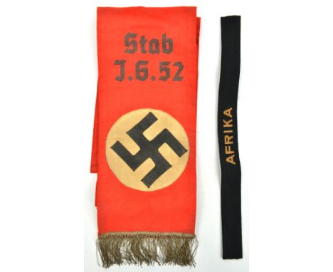 A Third Reich funeral sash,  with 2 piece overlaid stitched device, silver wire fringe, and printed in black “Stab J.G. 52”; 