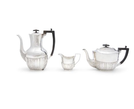A SILVER THREE PIECE TEA AND COFFEE SERVICE, Sheffield c.1911, mark of John Henry Potter, comprising: a coffee pot, teapot an