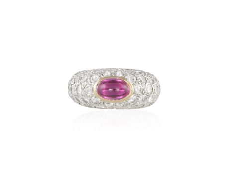 A SYNTHETIC RUBY AND DIAMOND RINGThe collet-set oval-shaped ruby cabochon, within a domed brilliant-cut mount, mounted in 18K