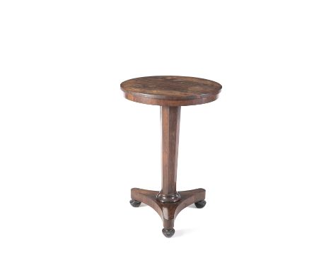 A GEORGE IV ROSEWOOD CIRCULAR OCCASIONAL TABLE, the plain top raised on an octagonal tapering centre pillar and tripod platfo