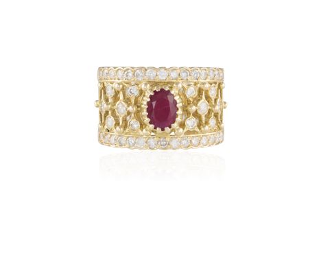 A RUBY AND DIAMOND DRESS RINGThe oval-shaped ruby within a pierced geometric patterned mount with round brilliant-cut diamond