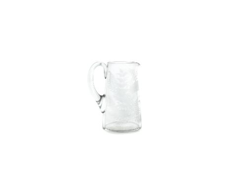 A LATE 19TH CENTURY IRISH GLASS JUG, probably T &amp; R Pugh, of circular tapering form, engraved with fern sprays, initials 