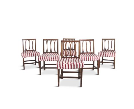 A SET OF SIX GEORGE IV MAHOGANY FORK BACK DINING CHAIRS, each with rectangular backs, with three-bar splat, covered in a crim