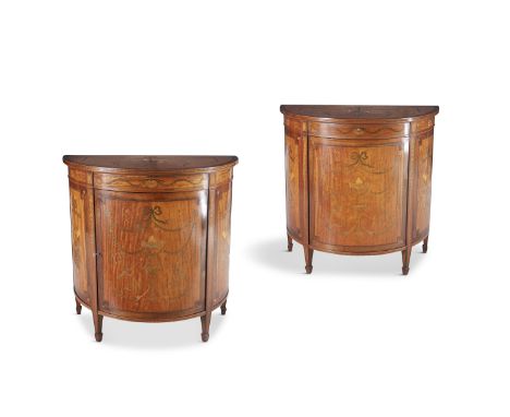 A PAIR OF GEORGE III STYLE INLAID SATINWOOD, ROSEWOOD AND BURR WALNUT DEMI-LUNE SIDE CABINETS, the crossbanded tops, single p