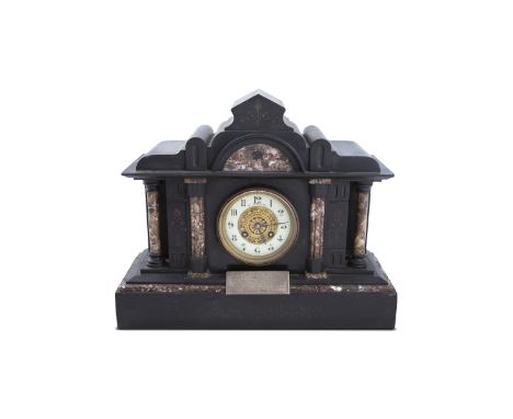 A 19TH CENTURY BLACK MARBLE ARCHITECTURAL MANTEL CLOCK, c.1880, with mottled marble columns, drum dial in white enamel, on pl