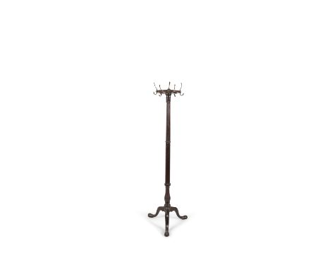 A 19TH CENTURY MAHOGANY HAT AND COAT STAND, the reeded disk top with five gilt metal hooks on cluster column support and trif