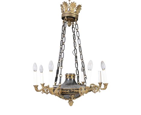 A REGENCY STYLE BLACK AND GILT METAL EIGHT BRANCH CEILIING LIGHT, with leaf corona, and circular body suspended from four int