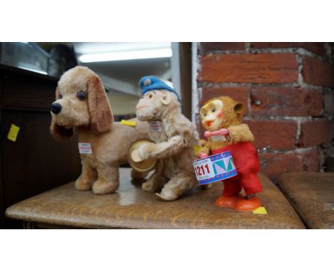 Three 1960s/70s clockwork automaton toys, largest 20cm high. 