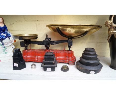 A set of vintage French red painted cast iron kitchen scales, with weights. 