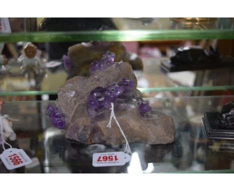 An unusual carved amethyst crystal frog figure group, 16.5cm wide. 