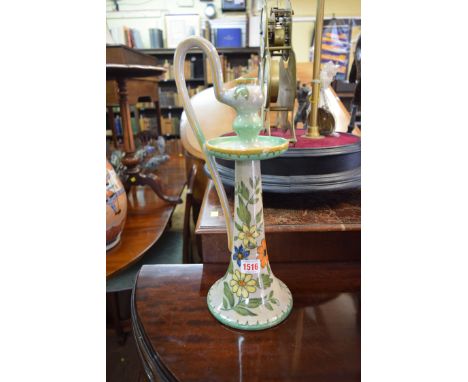 A Gouda pottery candlestick, 41cm high. 