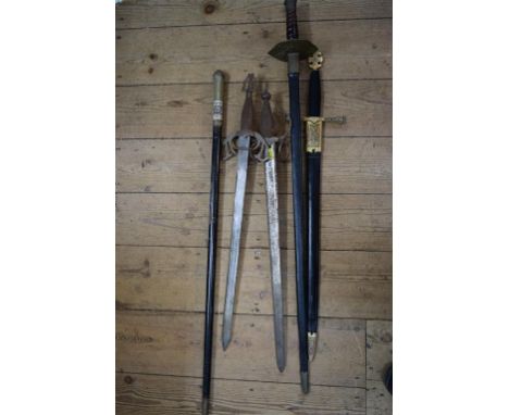 Four various reproduction swords, two with scabbards; and an Indian swordstick. 