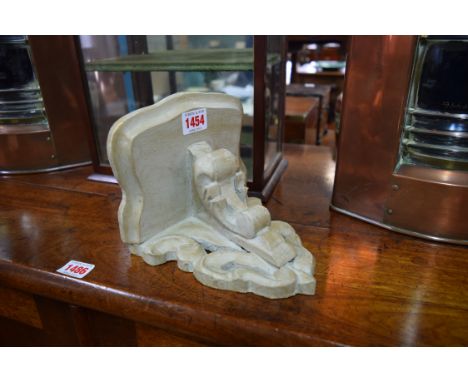 A grey painted carved wood wall bracket, 18cm wide. 