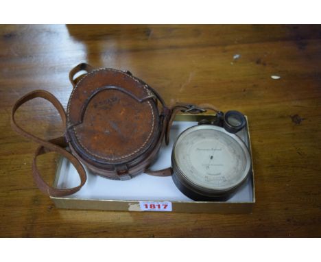 A late Victorian large brass cased pocket barometer, in original fitted leather case.