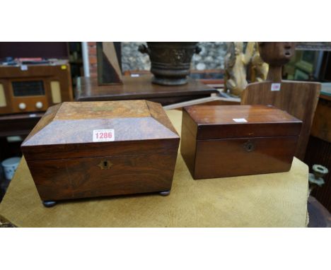 A 19th century rosewood sarcophagus form tea caddy, 23cm wide; and an early 19th century mahogany tea caddy. 