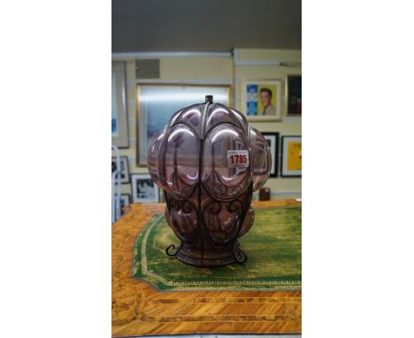 An amethyst glass and metal lantern, 26cm high, (chips to rim of glass).