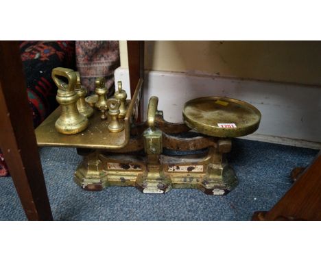 A set of brass and cast iron kitchen scales.