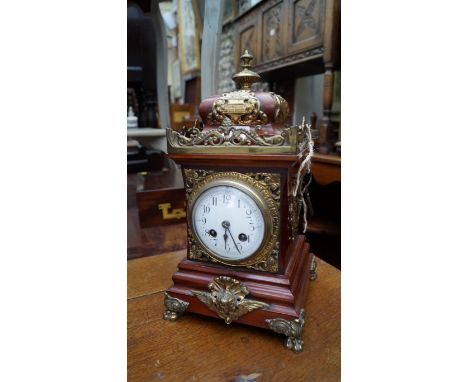A mahogany and brass mantel clock, 34cm high. 