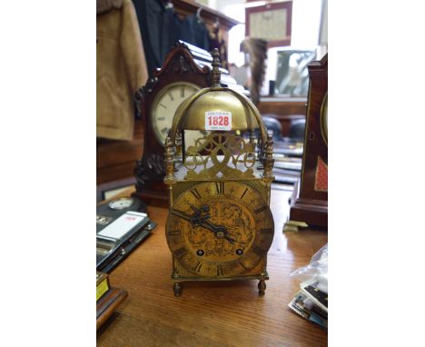 An early 20th century brass lantern style clock, 32.5cm high.