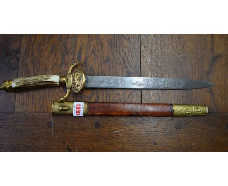 A Continental hunting sword and scabbard, with antler grip.