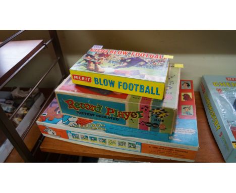 A Chad Valley Disneyland projector, boxed; together with a Marx Toys record player, boxed; and a Merit blow football game, bo