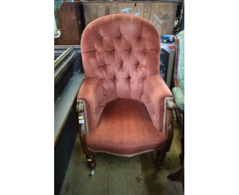 A Victorian carved mahogany framed and button upholstered occasional armchair. 