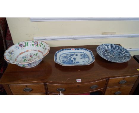 A Chinese blue and white chamfered rectangular dish, 18th century, 35cm wide, (shallow chips); together with an 18th century 