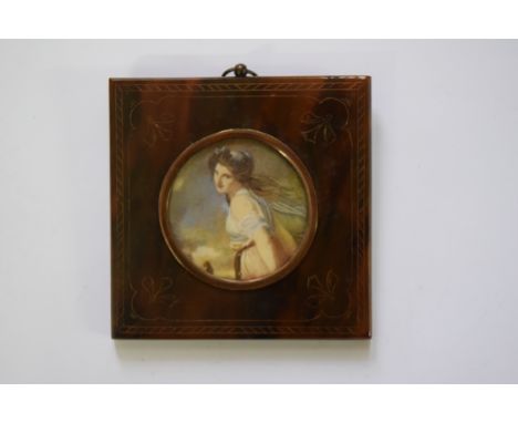 A half length portrait miniature of a classical lady, 4.5cm diameter, in tortoiseshell frame. 