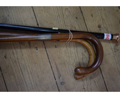 A 9ct gold mounted ebony cane; together with a silver mounted walking stick and another blackthorn walking stick. 